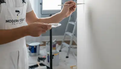 Baltimore, MD painter repairing touch-up paint on a home wall for clean, lasting finishes